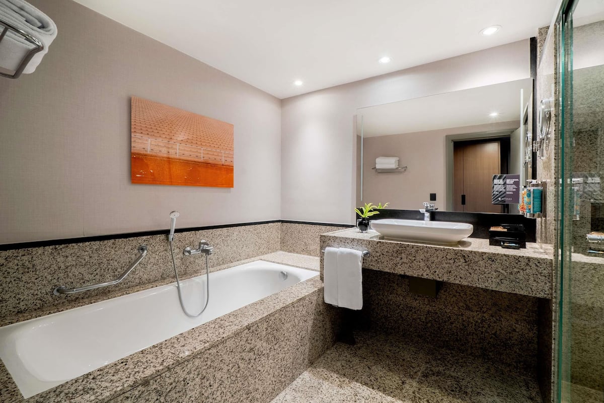 Family Suite, Multiple Beds, Club Lounge Access | Bathroom | Eco-friendly toiletries, hair dryer, towels, soap