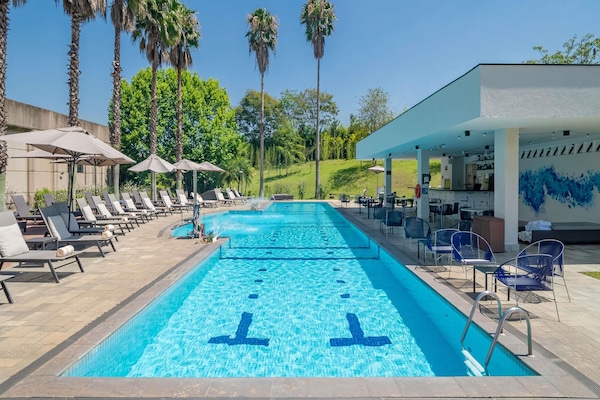 Outdoor pool, pool umbrellas, sun loungers