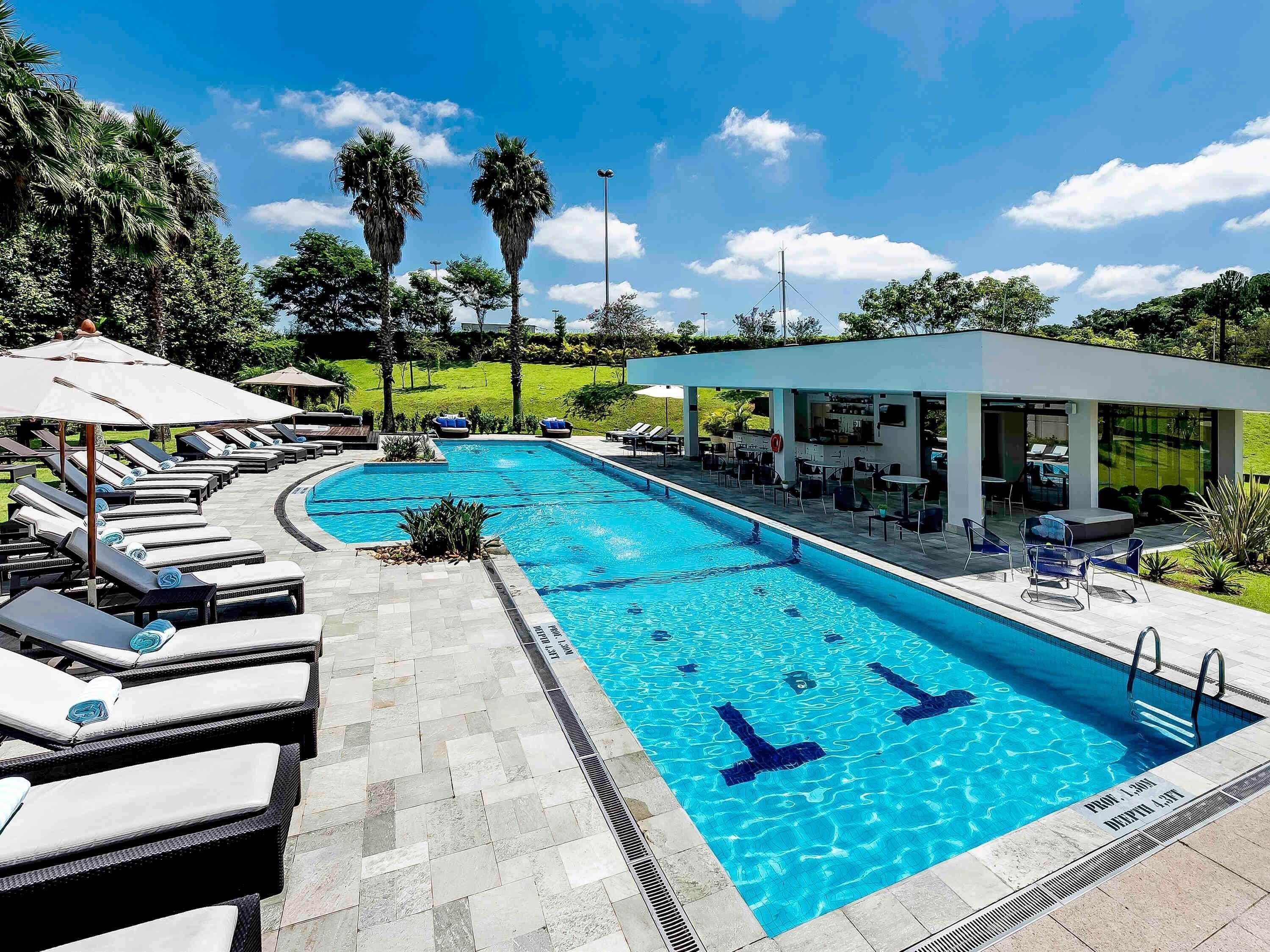 Outdoor pool, pool umbrellas, sun loungers