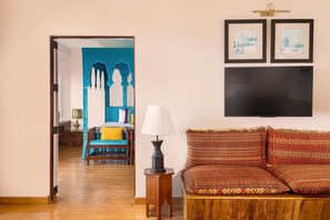Themed Suites | Living room | 30-inch LCD TV with satellite channels, TV