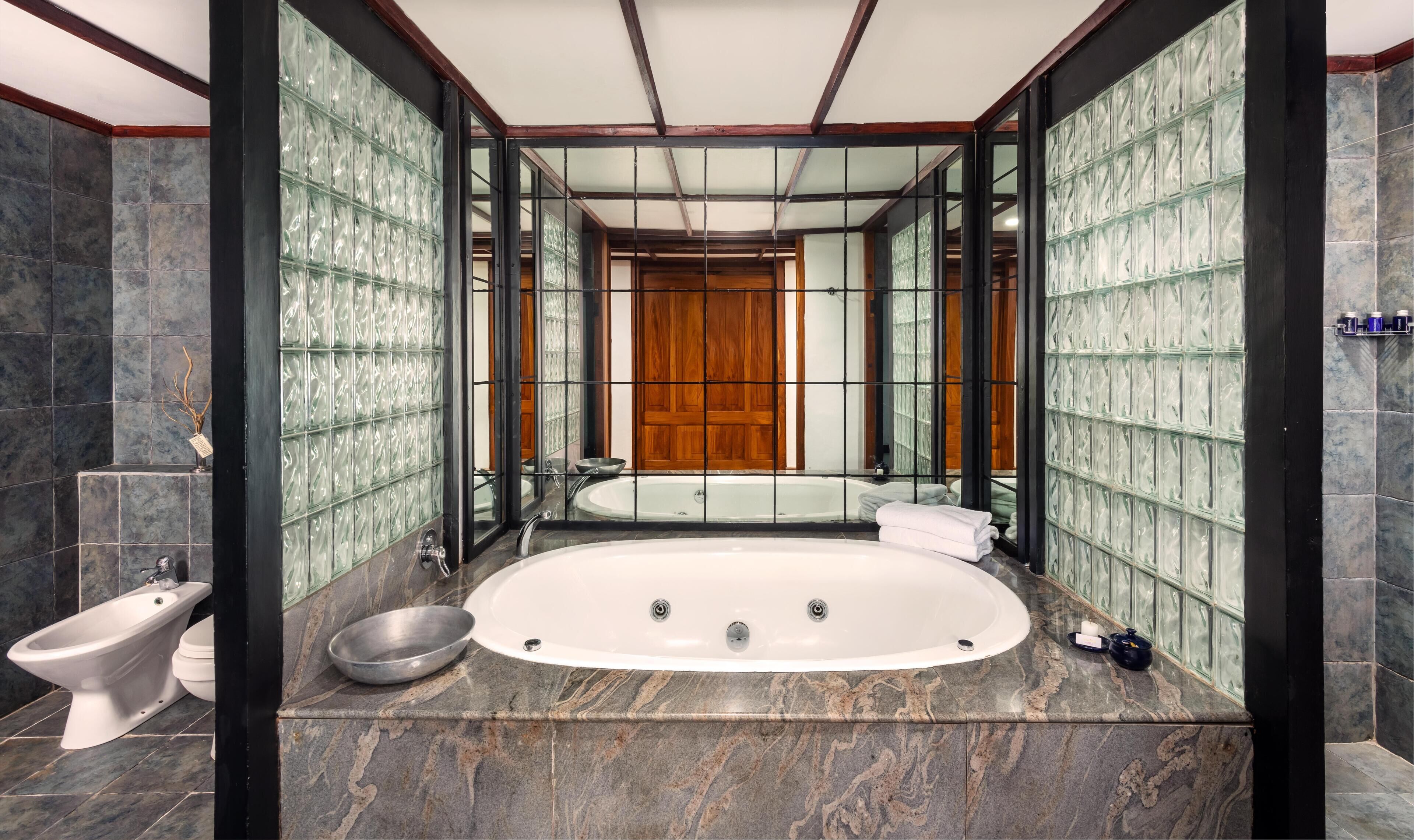 themed suites | bathroom | separate bathtub and shower, free toiletries, hair dryer, bathrobes
