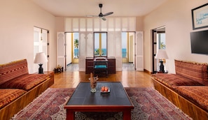 Themed Suites | Living room | 30-inch LCD TV with satellite channels, TV