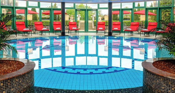 Indoor pool, open 7:00 AM to 10:00 PM, pool loungers