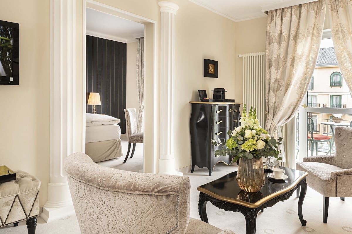 Grand Suite, 1 King Bed | Living area | 32-inch LCD TV with satellite channels, TV