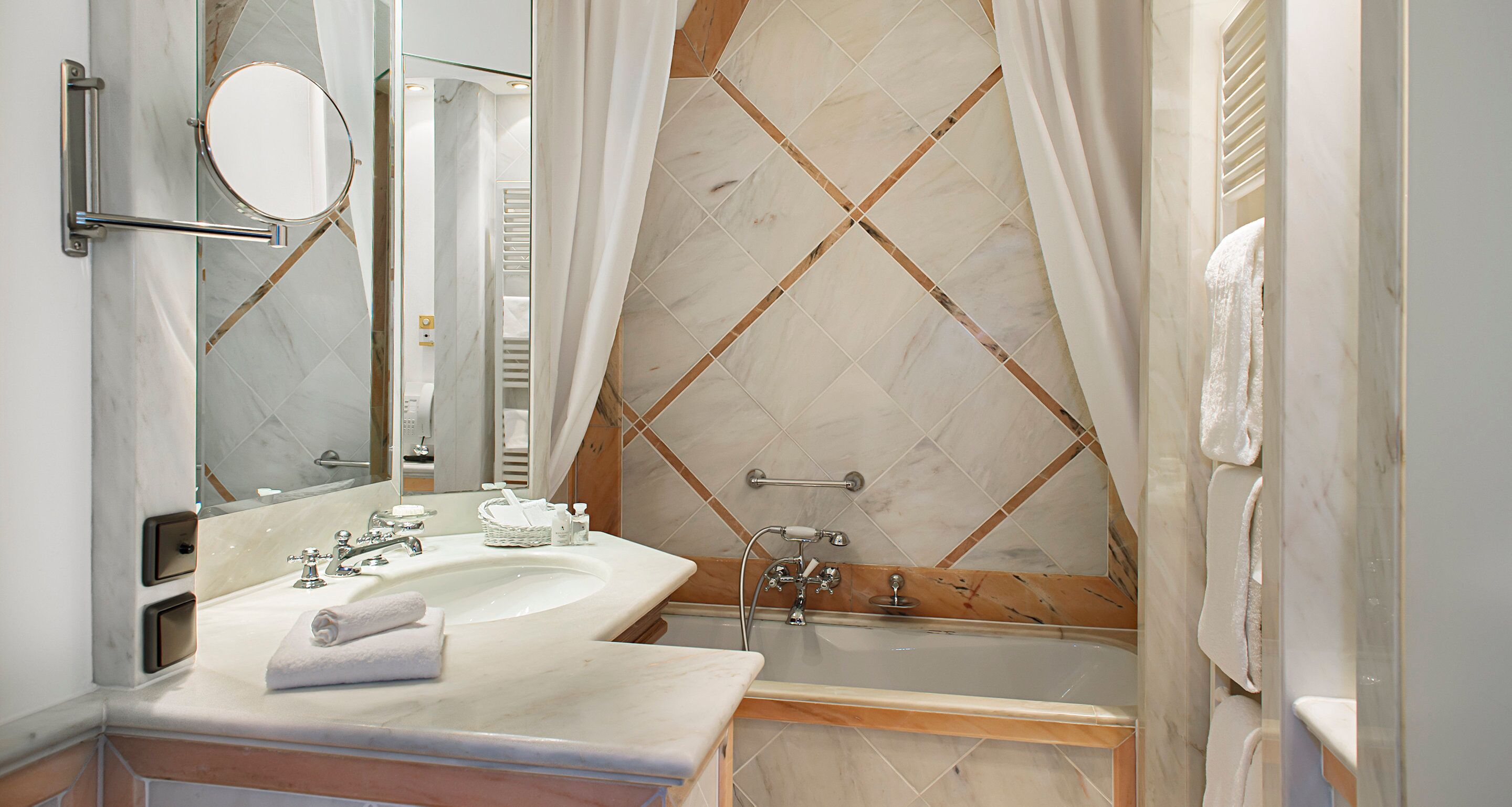 designer toiletries, hair dryer, bathrobes, slippers