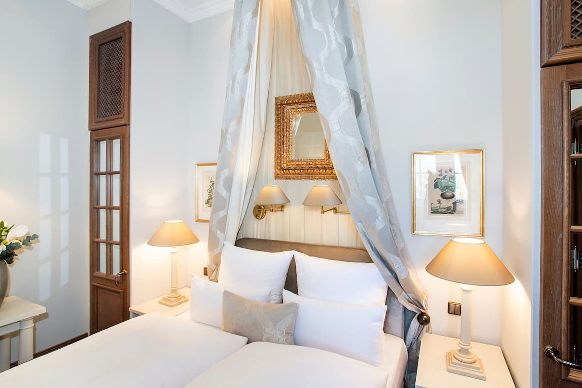 1 bedroom, hypo-allergenic bedding, down duvets, minibar