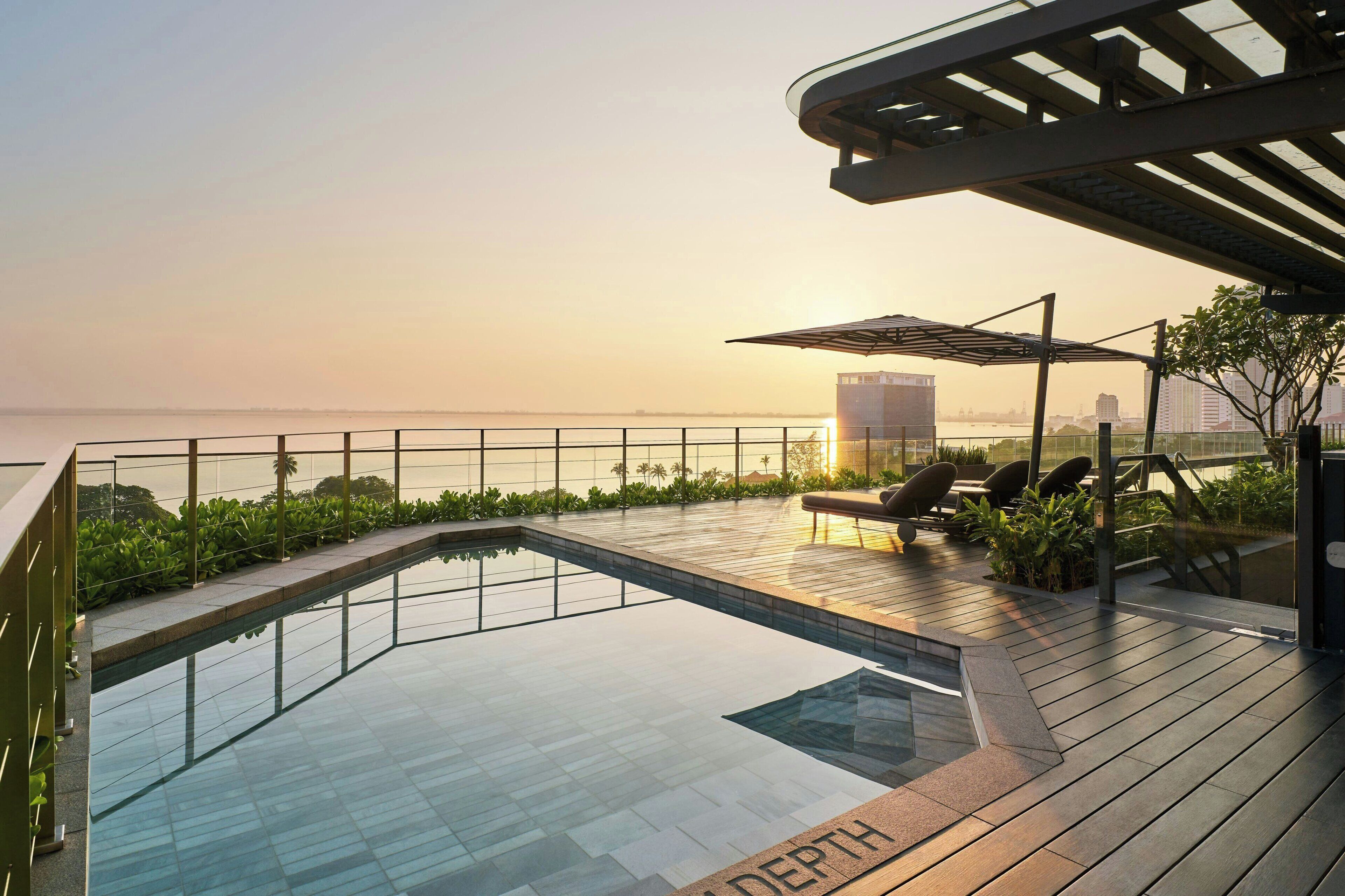 Outdoor pool, open 7:00 AM to 8:00 PM, pool umbrellas, pool loungers