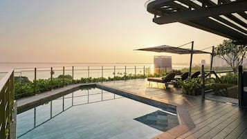 Outdoor pool, open 7:00 AM to 8:00 PM, pool umbrellas, pool loungers