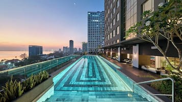 Outdoor pool, open 7:00 AM to 8:00 PM, pool umbrellas, pool loungers