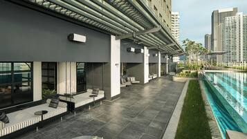 Outdoor pool, open 7:00 AM to 8:00 PM, pool umbrellas, pool loungers