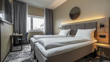 Desk, laptop workspace, bed sheets, wheelchair access