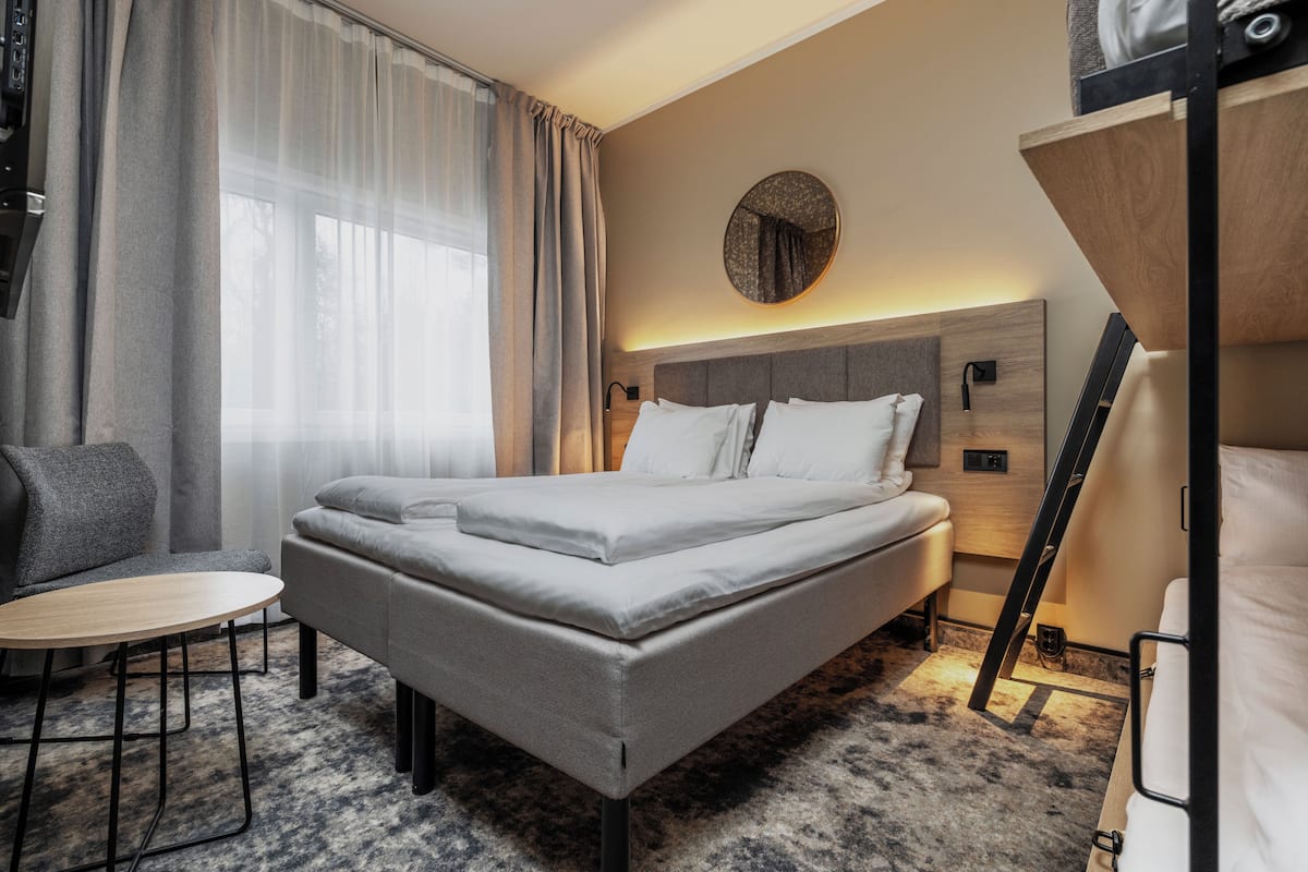 Desk, laptop workspace, bed sheets, wheelchair access