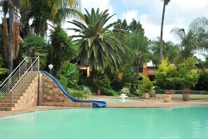 Outdoor pool, pool umbrellas, sun loungers
