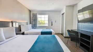 Laptop workspace, bed sheets, alarm clocks