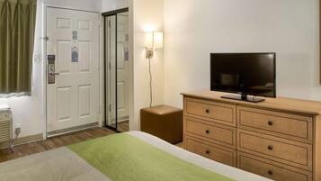 Laptop workspace, bed sheets, alarm clocks