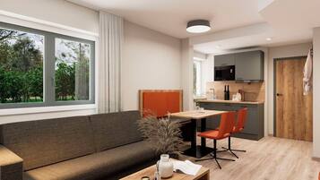 Suite Deluxe, 1 cama Queen size y sofá cama | Área de sala de estar | Televisión LED de 43 pulgadas con canales por cable y oficina