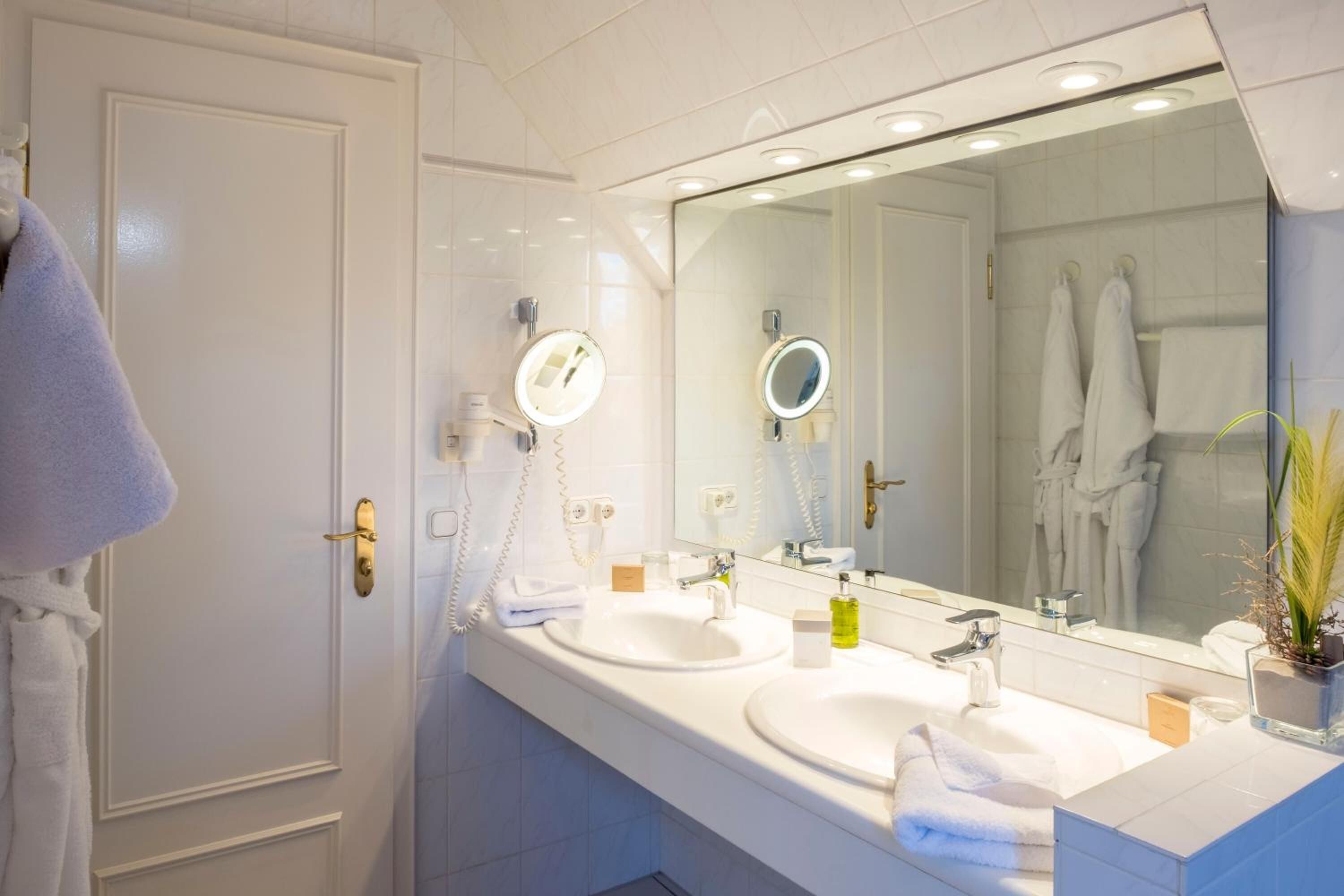 shower, hair dryer, bathrobes, slippers