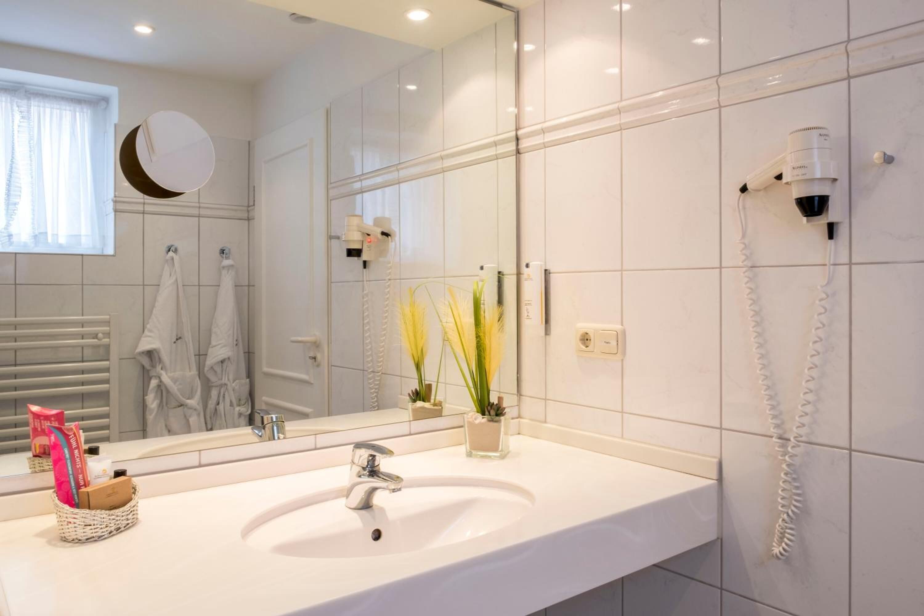 shower, hair dryer, bathrobes, slippers