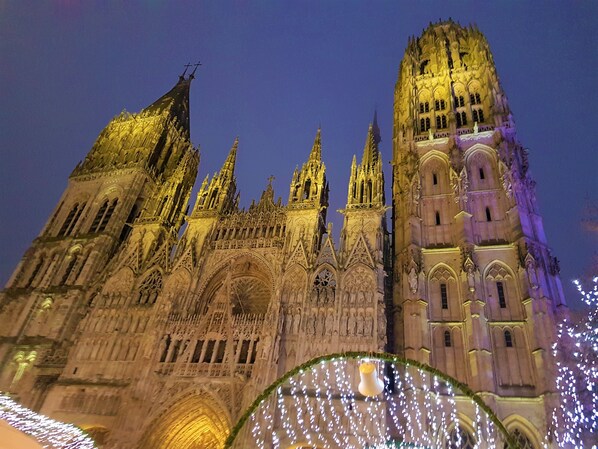 A Gothic-style cathedral with intricate architecture and illuminated details.