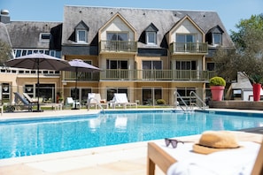 Outdoor pool, open 9:00 AM to 9:00 PM, pool umbrellas, sun loungers
