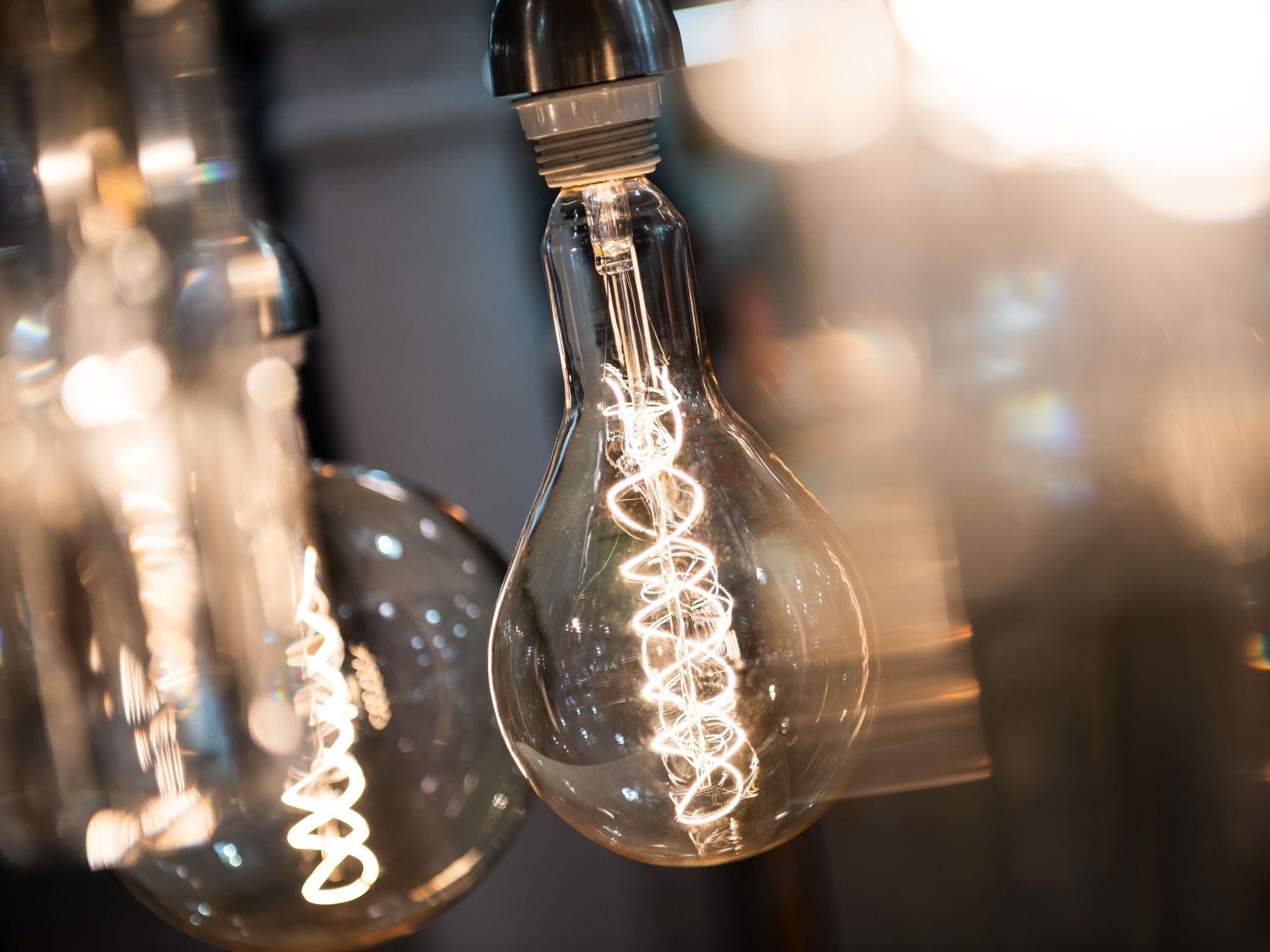 A close-up of a light bulb with a spiral filament design.