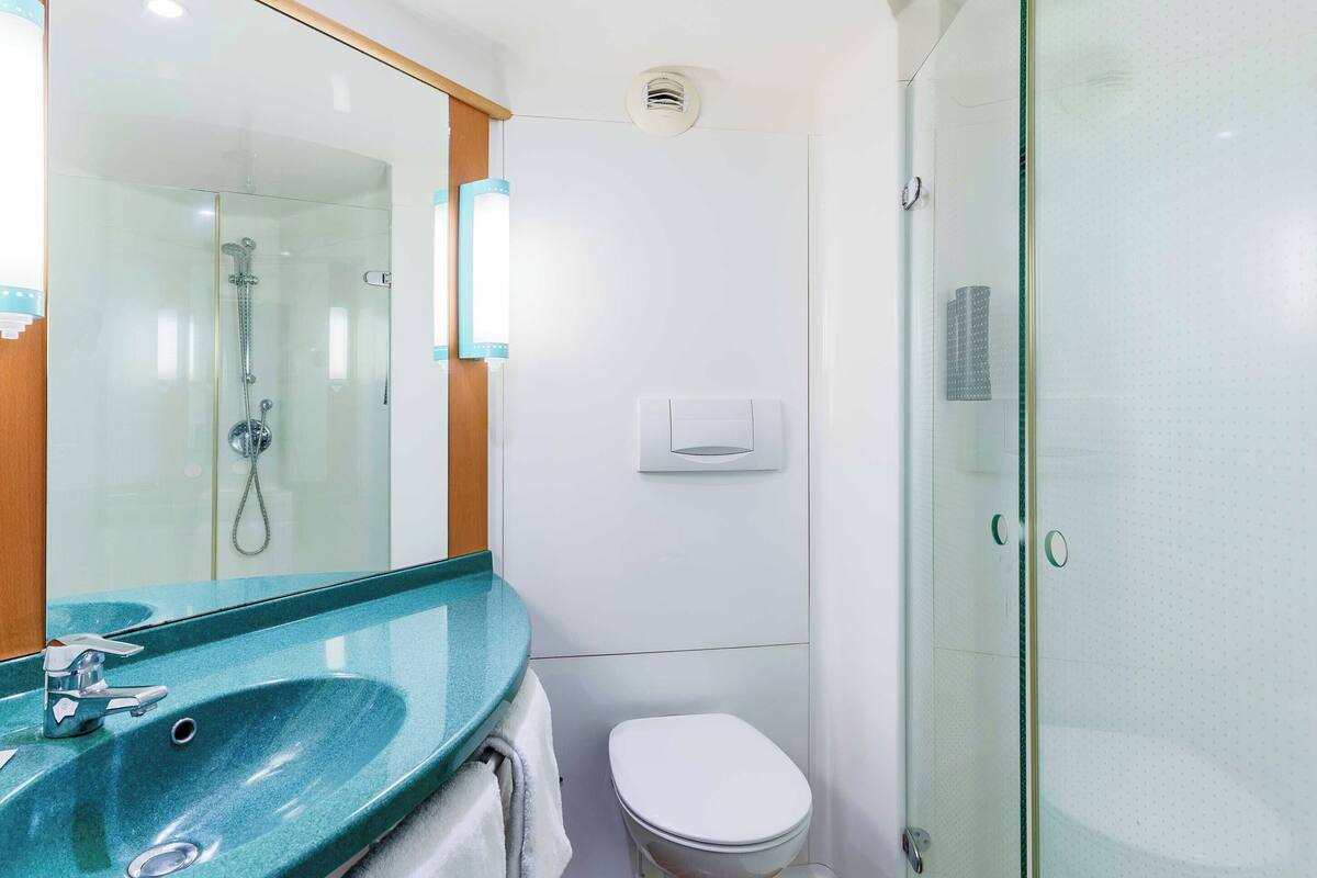 shower, eco-friendly toiletries, hair dryer, towels