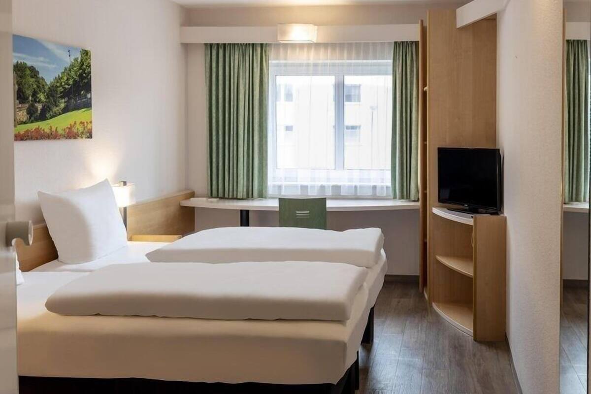 Desk, blackout curtains, free cots/infant beds, free WiFi