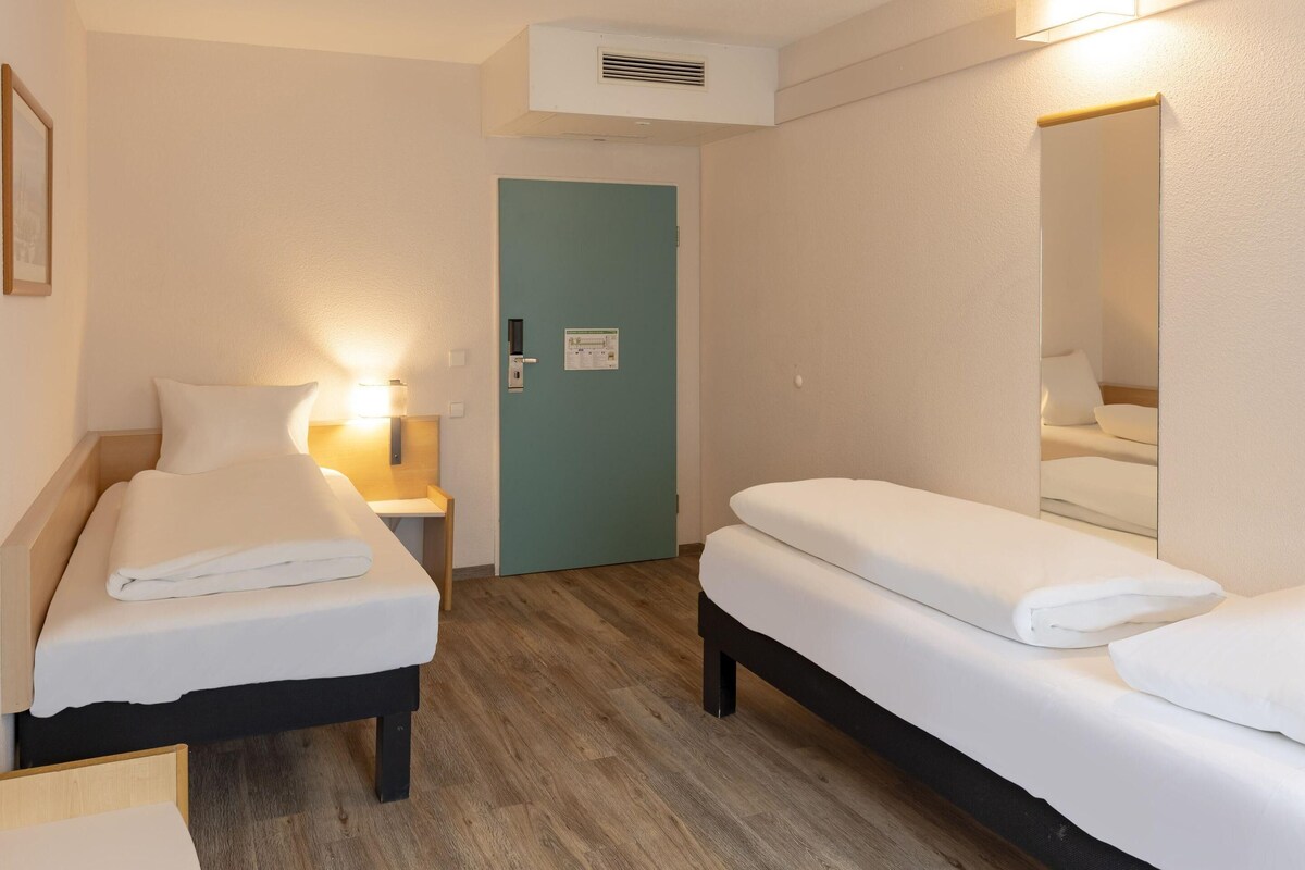 Desk, blackout curtains, free cots/infant beds, free WiFi