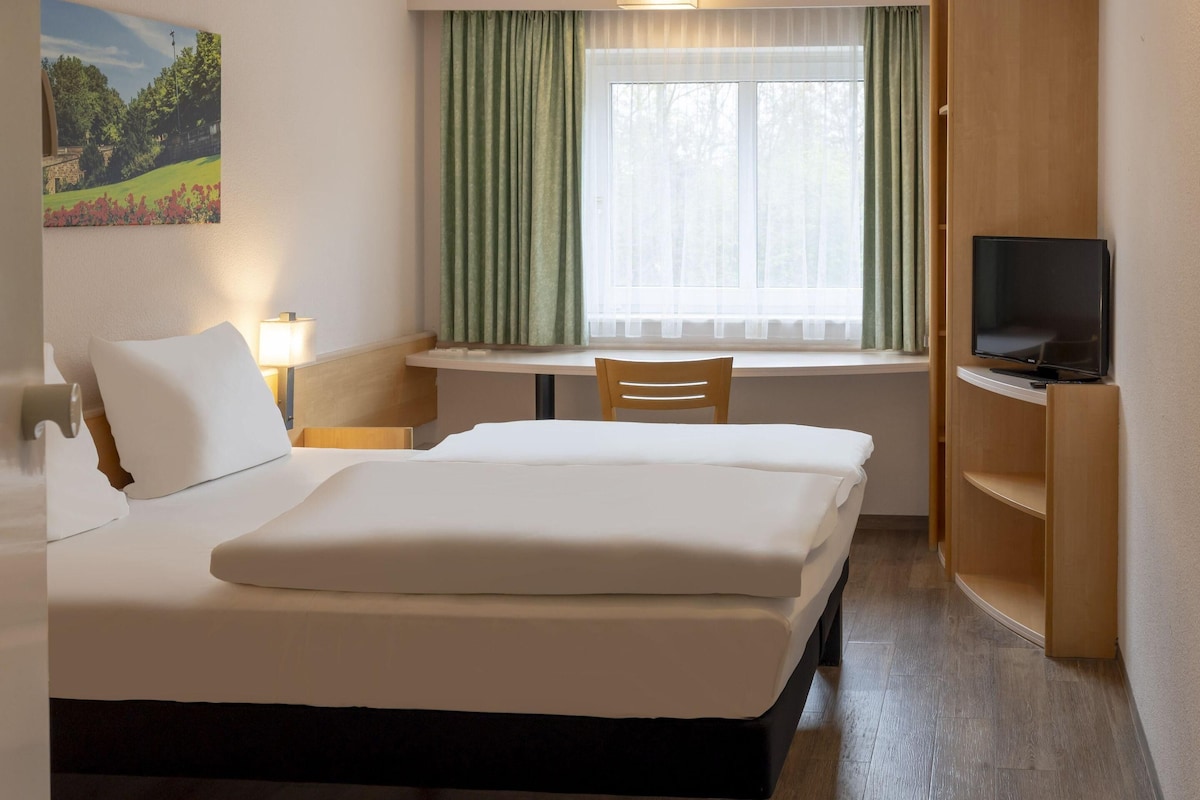 Desk, blackout curtains, free cots/infant beds, free WiFi