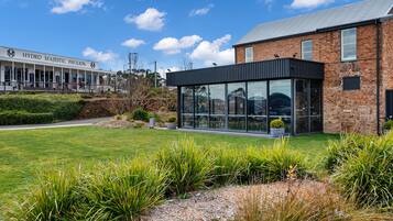 A modern building with a glass facade and a sign reading "HYDRO MAJESTIC PAVILION".
