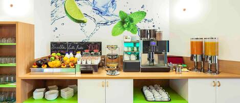 A beverage station with a coffee machine, two dispensers, and a selection of fruits and syrups.