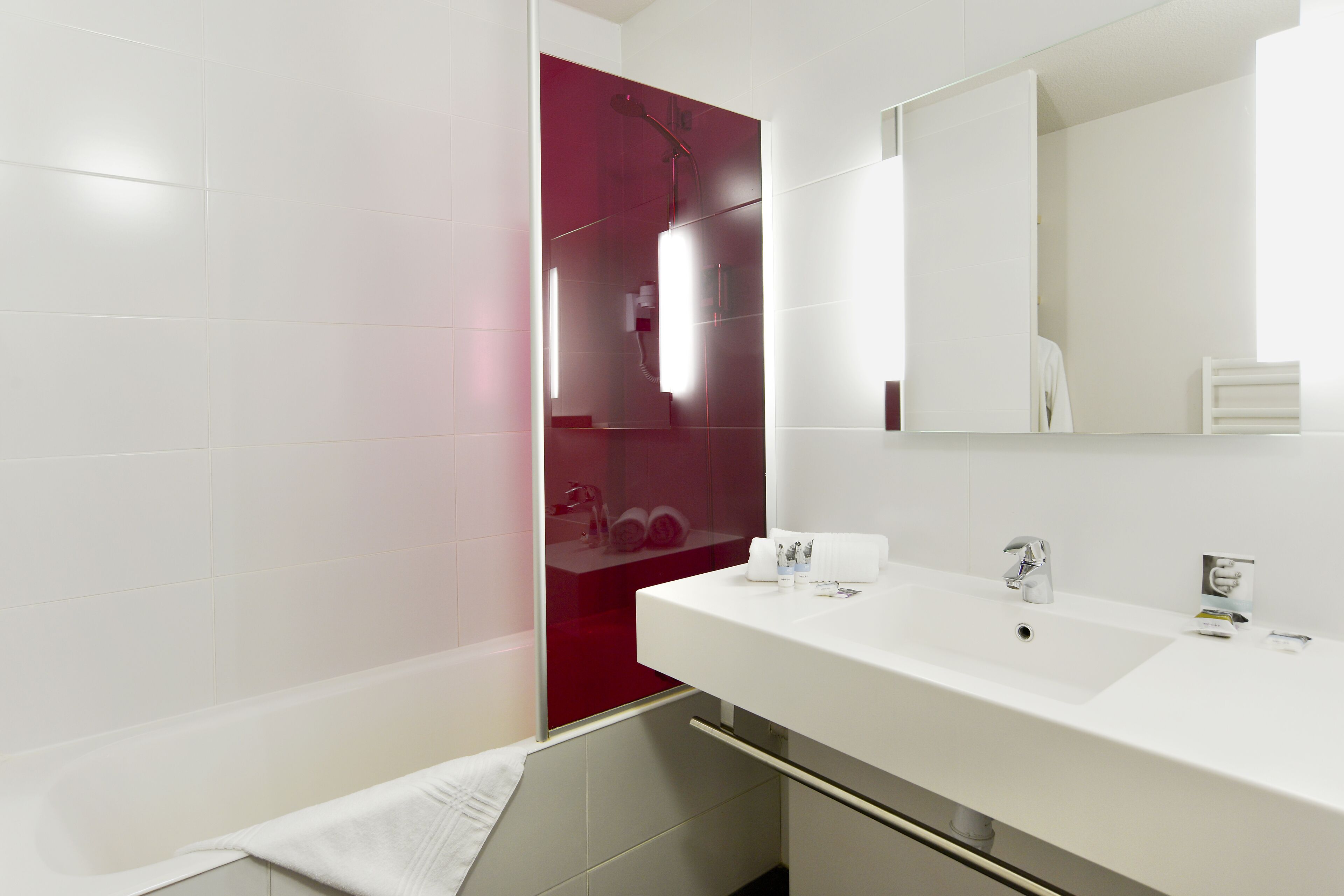 bathtub, eco-friendly toiletries, hair dryer, bathrobes