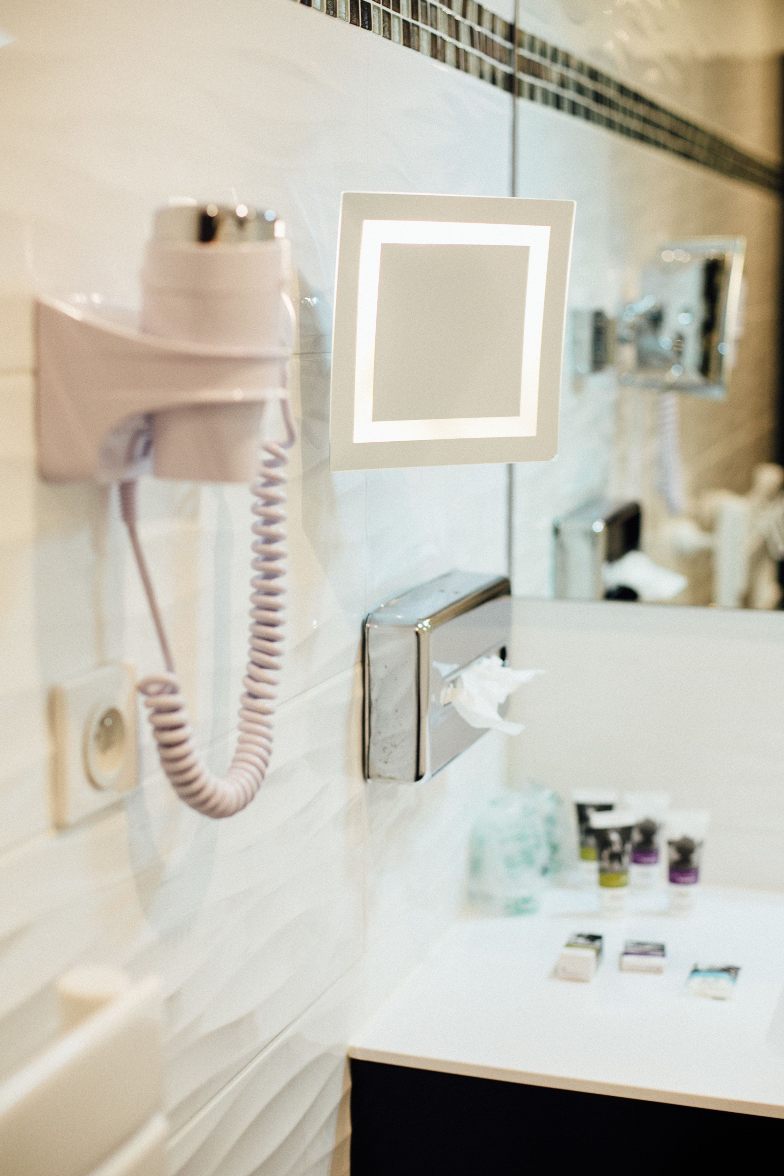 eco-friendly toiletries, hair dryer, towels