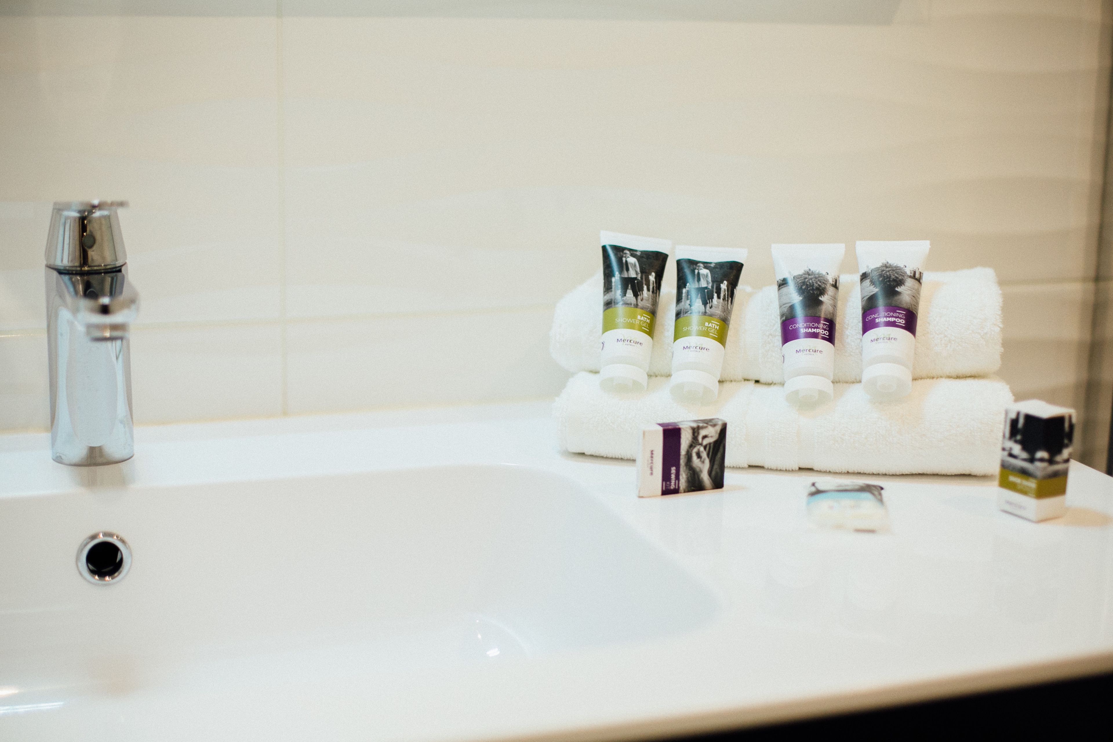 eco-friendly toiletries, hair dryer, towels