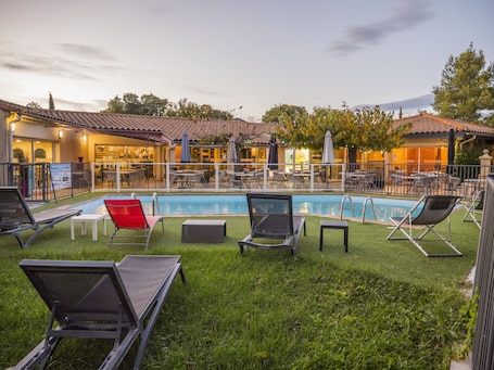 Outdoor pool, open 8:00 AM to 7:00 PM, pool umbrellas, sun loungers. Logis Hotel Uzes Pont du Gard