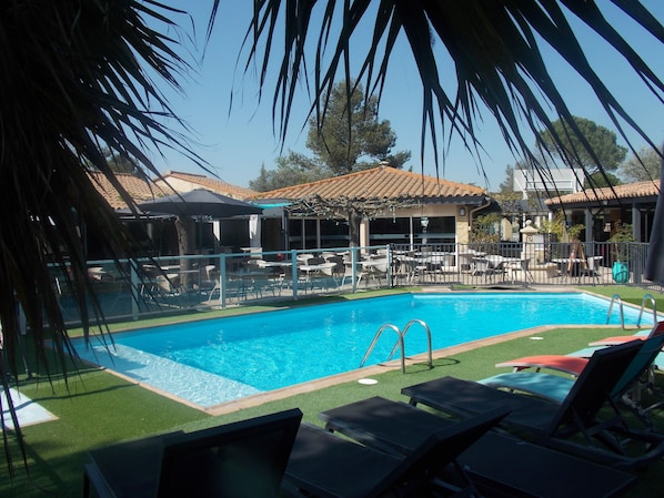Outdoor pool, open 8:00 AM to 7:00 PM, pool umbrellas, pool loungers