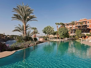 Indoor pool, outdoor pool, pool umbrellas, pool loungers