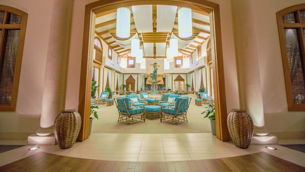 A spacious lobby with a central seating area, large windows, and a fountain. - Ponte Vedra Inn & Club (Ponte Vedra Beach)