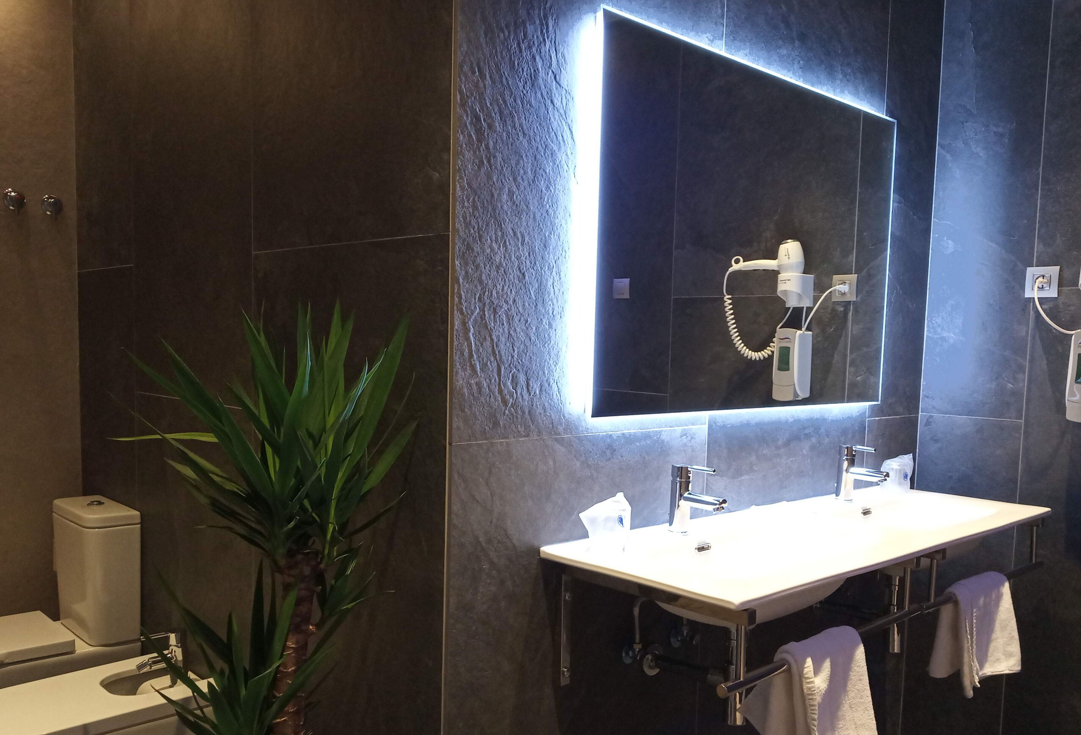 chromotherapy junior suite | bathroom | rainfall showerhead, free toiletries, hair dryer, towels