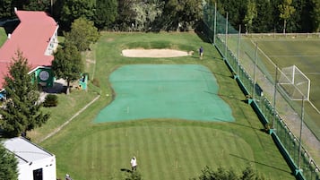 Enjoy a round of golf on our meticulously maintained course, surrounded by lush greenery and scenic views.