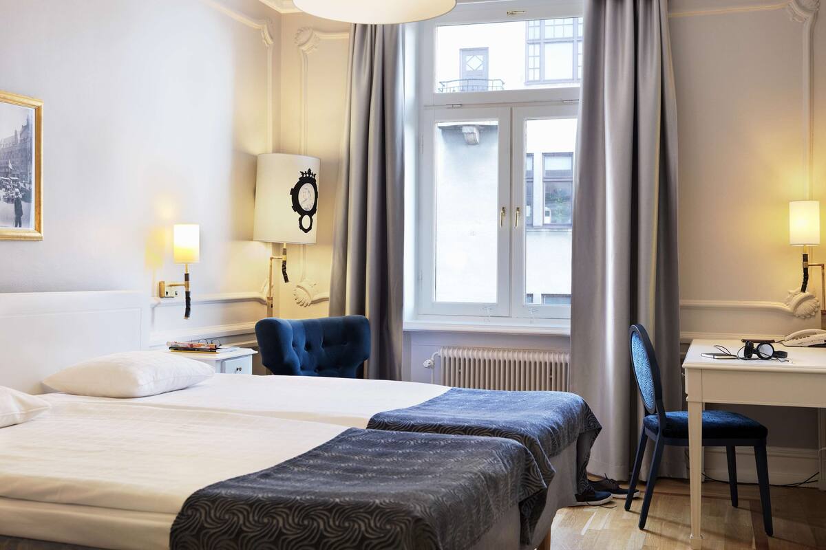 twin room, 2 single beds | desk, blackout curtains, iron/ironing board, free wifi