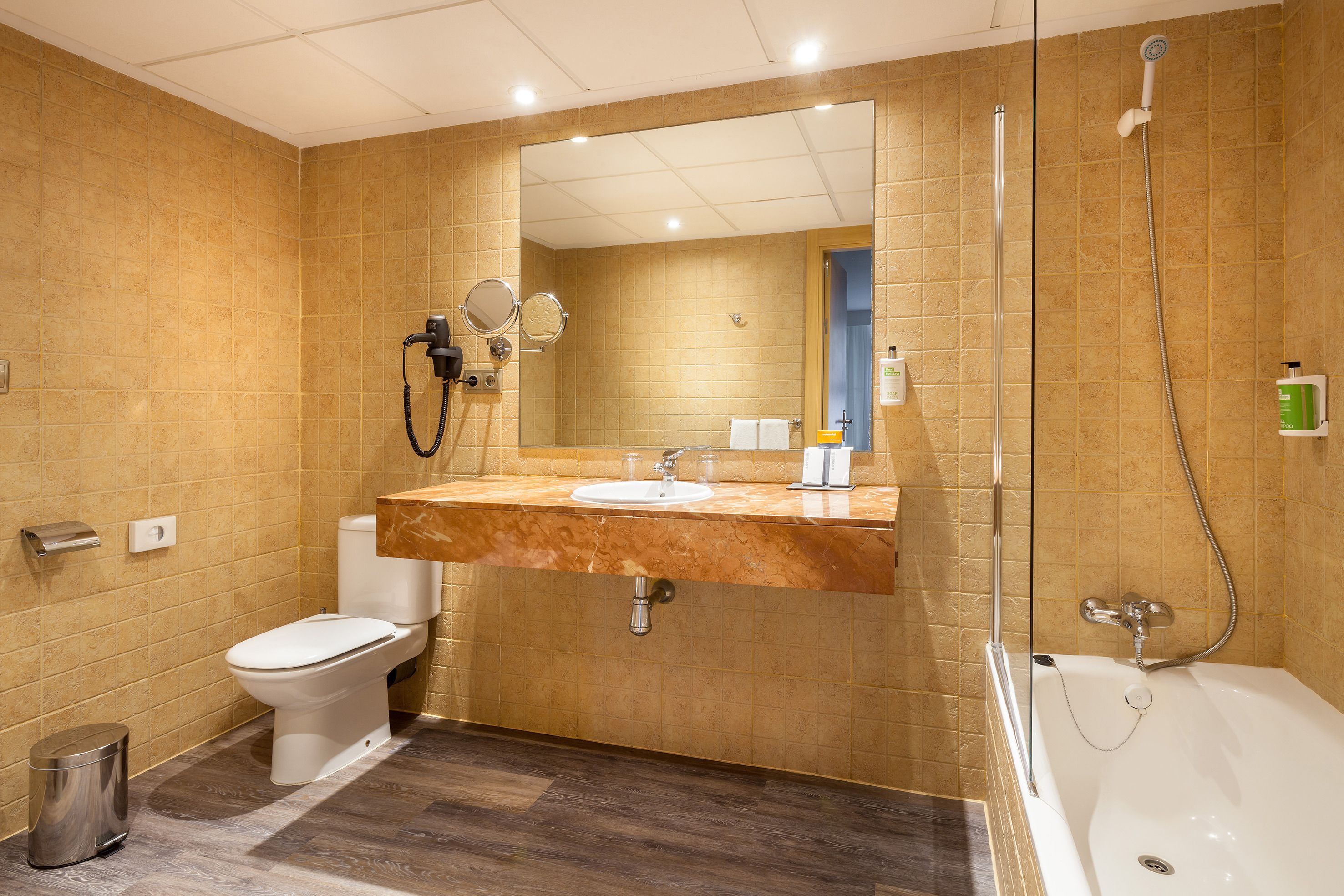 eco-friendly toiletries, hair dryer, bidet, towels