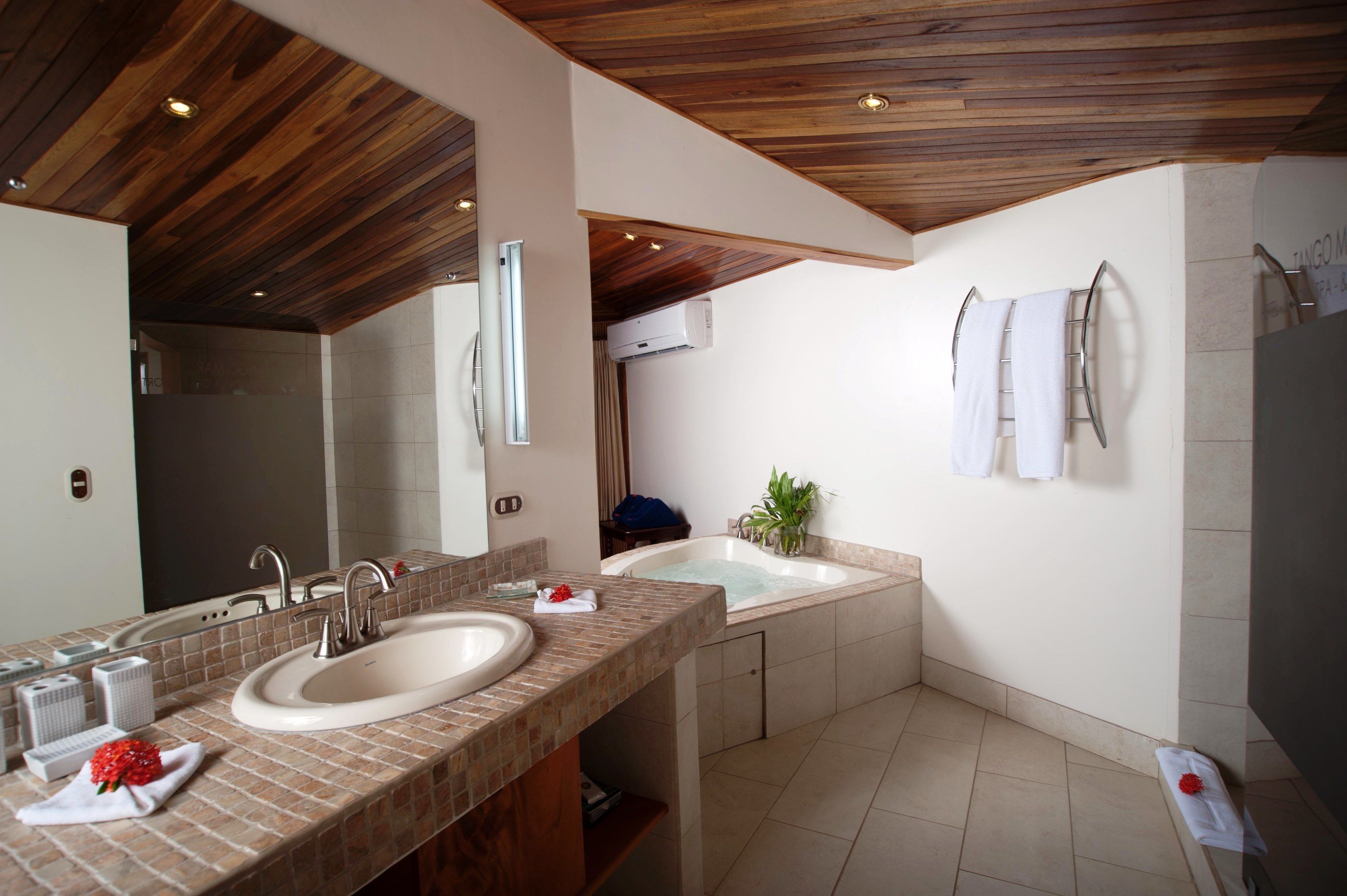 suite, ocean view (tiki suite) | bathroom | shower, eco-friendly toiletries, hair dryer, towels