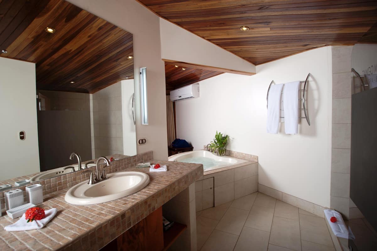 suite, ocean view (tiki suite) | bathroom | shower, eco-friendly toiletries, hair dryer, towels
