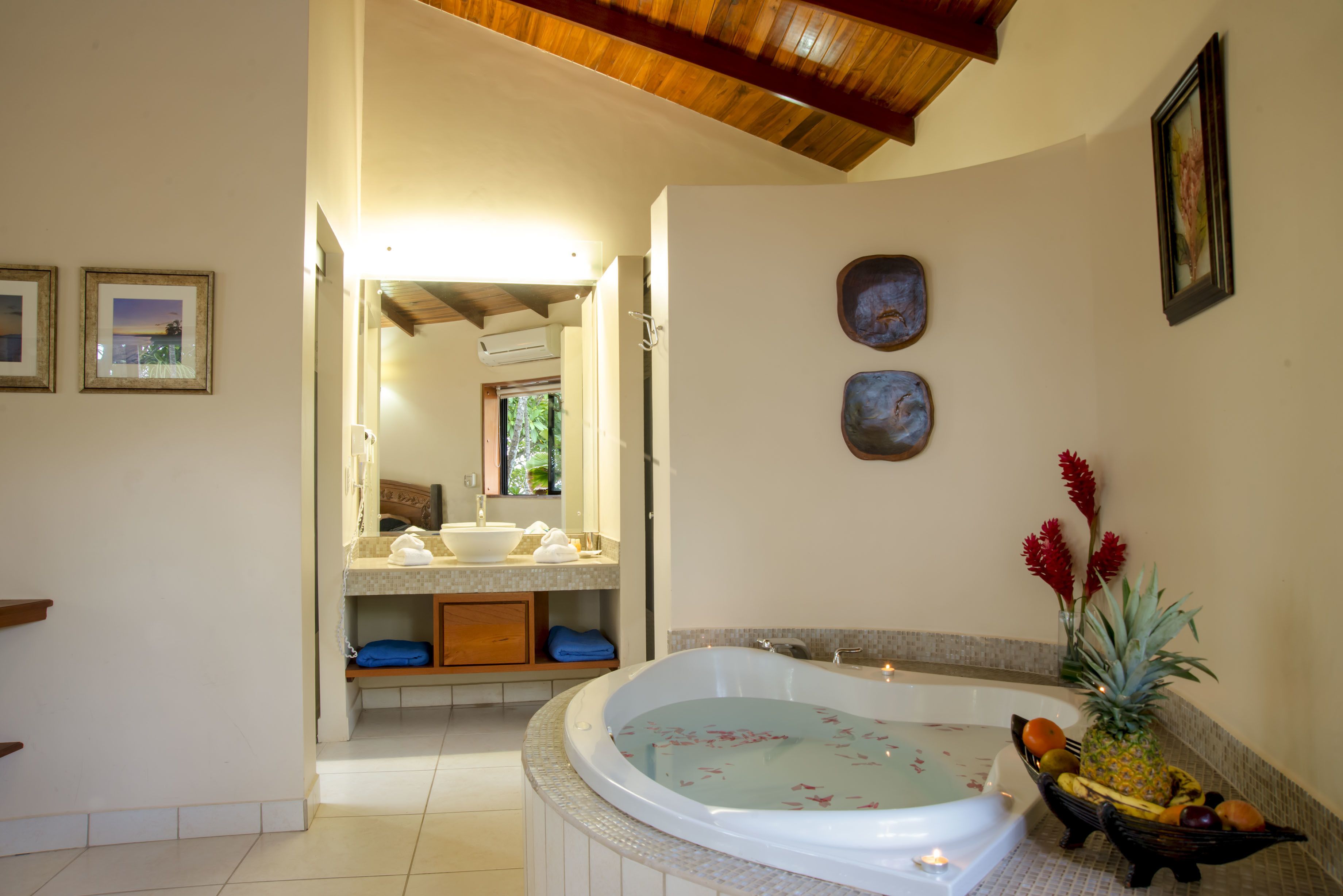 suite (tropical suite - jacuzzi) | bathroom | shower, eco-friendly toiletries, hair dryer, towels