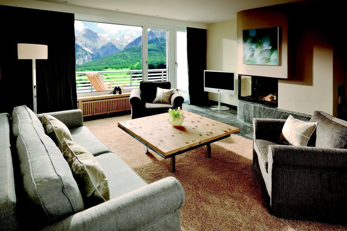 Grand Suite, 1 Bedroom, Balcony, Mountain View | Living area | TV, fireplace