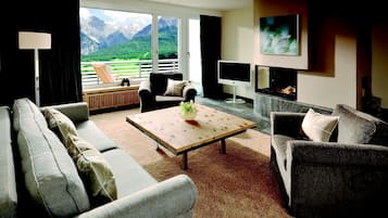 Grand Suite, 1 Bedroom, Balcony, Mountain View | Living area | TV, fireplace