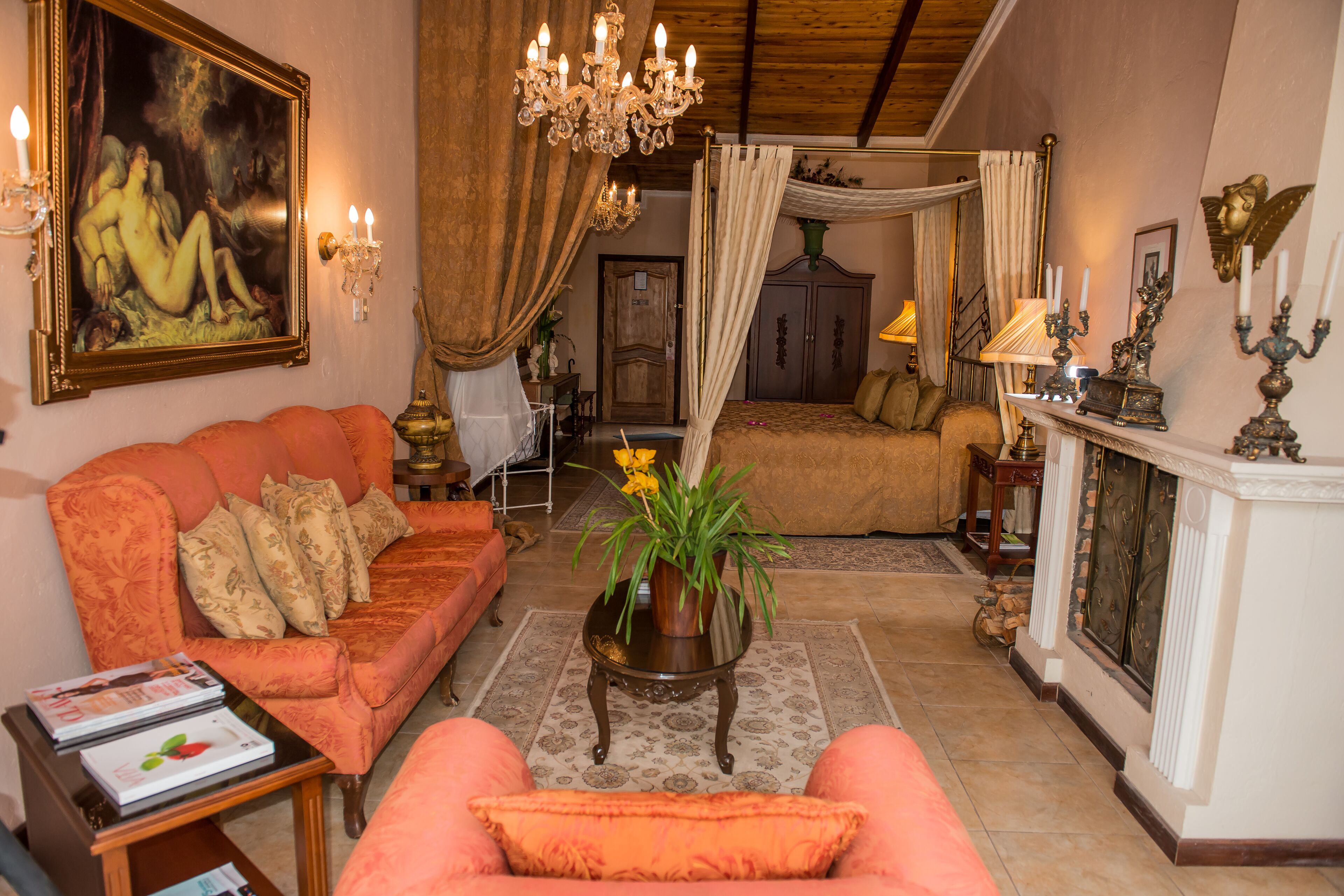 deluxe king suite | living room | 32-inch lcd tv with satellite channels, tv, fireplace