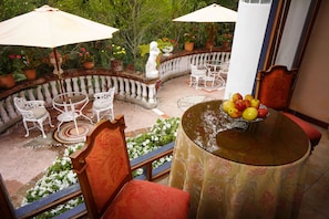 Deluxe King Suite | In-room safe, individually decorated, individually furnished, desk