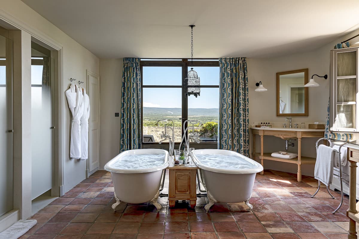 signature suite ventoux | bathroom | designer toiletries, hair dryer, bathrobes, slippers